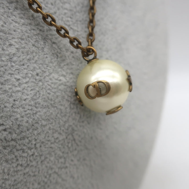 Christian Dior Tresor De Tribale Faux Pearl Pendant Necklace Brass