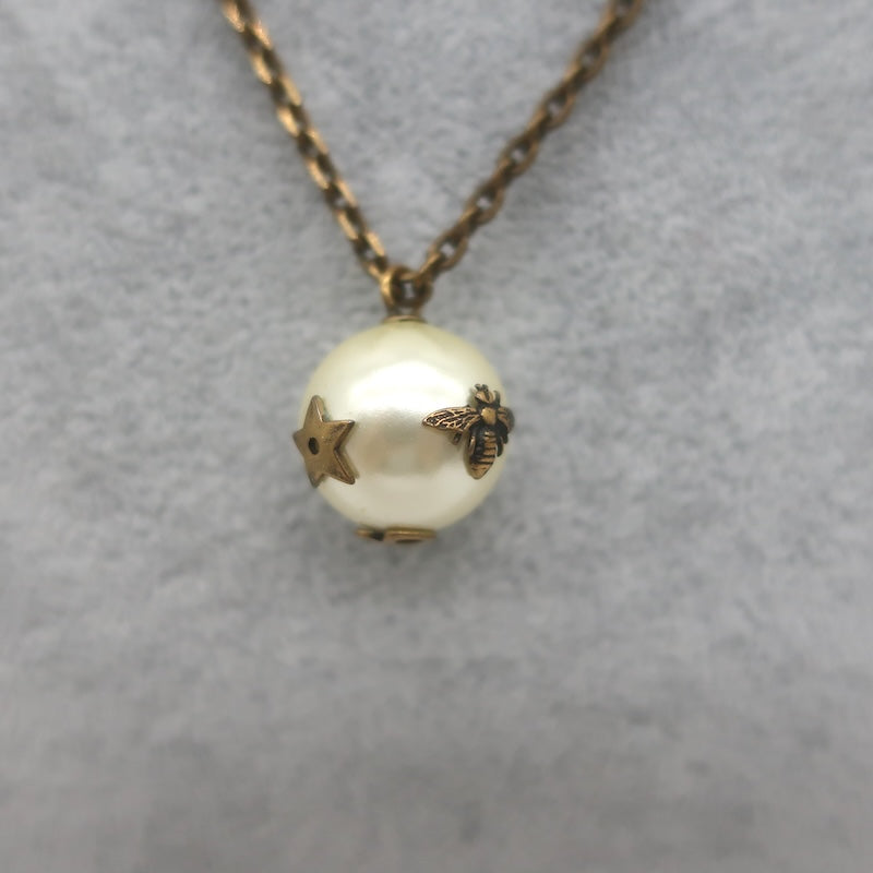 Christian Dior Tresor De Tribale Faux Pearl Pendant Necklace Brass