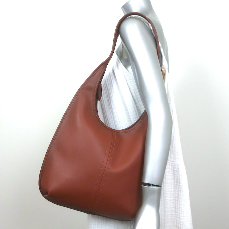 Handbags Brown Coach ladies sling bag at Rs 3350 in Balotra | ID:  2850595290430