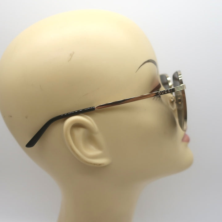 Gucci GG0802S 001, side profile with gold temple and black ear tip