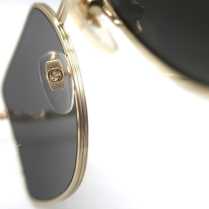 Gucci interlocking GG logo in clear nose pad, gold frame