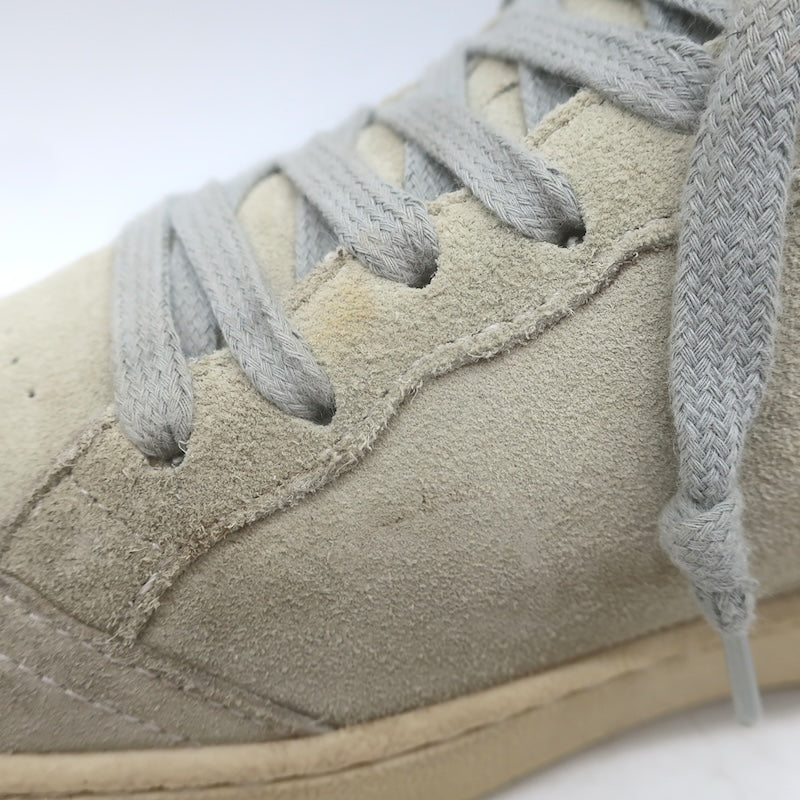 Golden Goose Ballstar suede eyelets and gray laces close-up