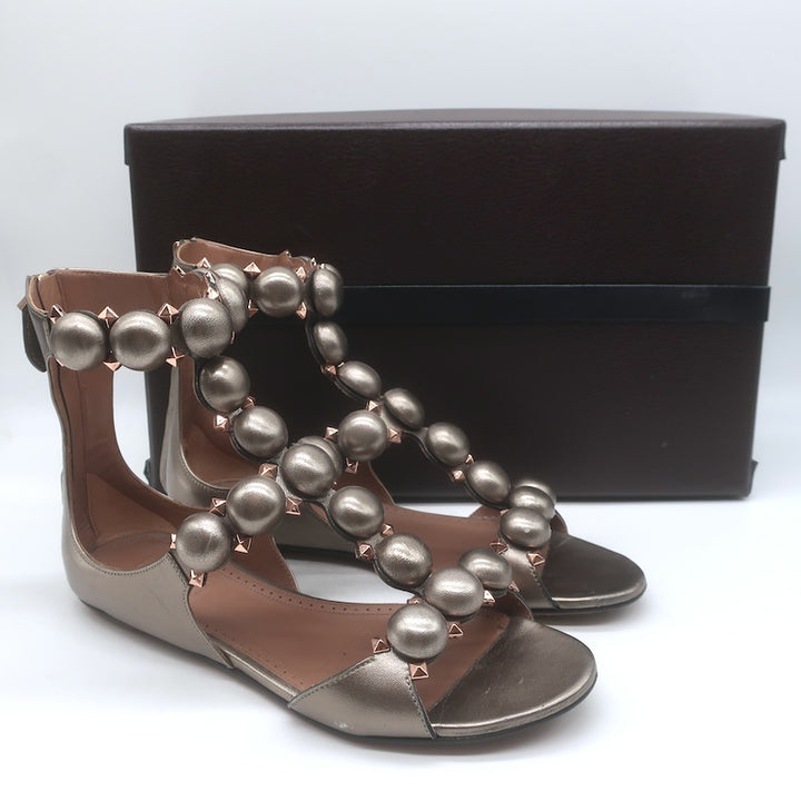 Alaia La Bombe Studded Flat Gladiator Sandals Rhodium Metallic Leather Size 37.5