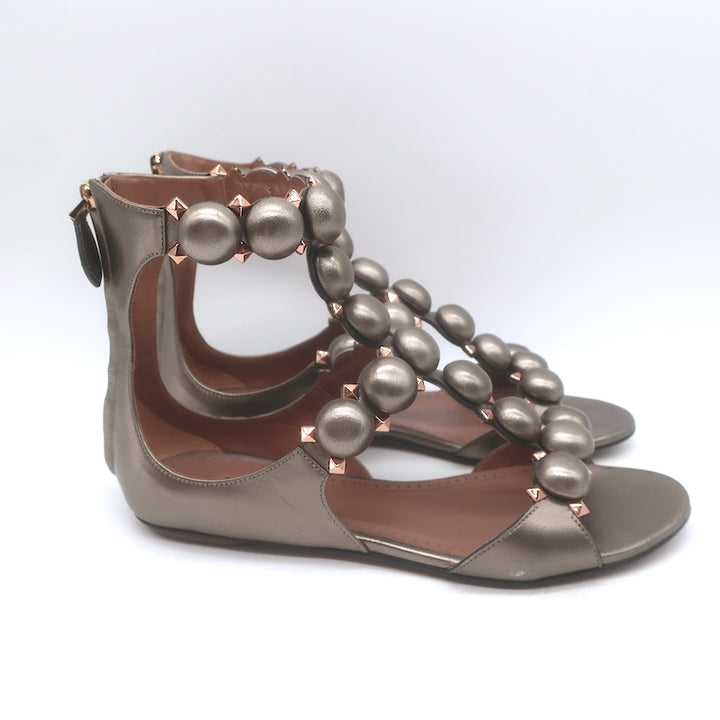 Alaia La Bombe Studded Flat Gladiator Sandals Rhodium Metallic Leather Size 37.5