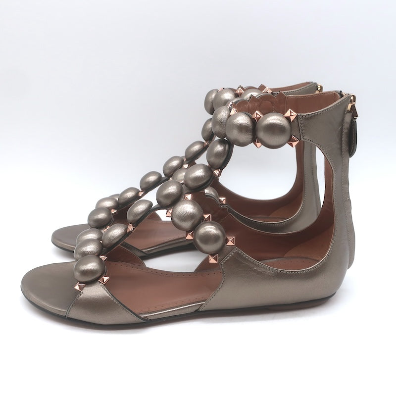 Alaia La Bombe Studded Flat Gladiator Sandals Rhodium Metallic Leather Size 37.5