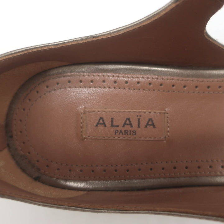Alaia La Bombe Studded Flat Gladiator Sandals Rhodium Metallic Leather Size 37.5