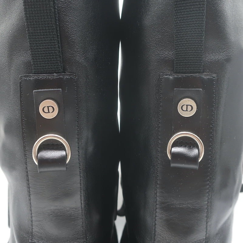 Christian Dior D-Fight lace-up combat boots in black stretch leather, pre-owned size 38 with light wear, authentic luxury.