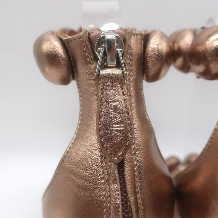 Alaia La Bombe 110 Ankle Strap Sandals Rose Gold Metallic Leather Size 38