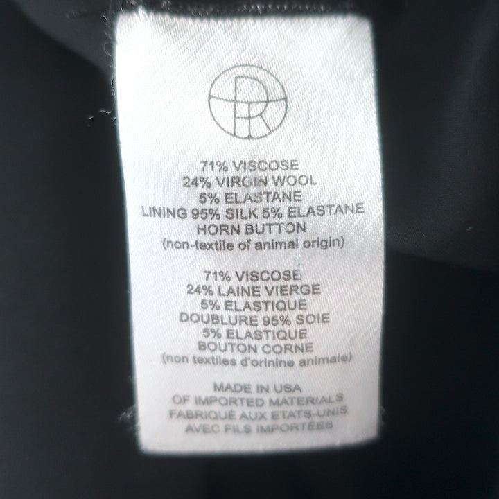 The Row double-breasted blazer, black stretch wool, size 4 — authentic pre-owned luxury piece, gently worn.