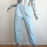 Authentic pre-owned SPRWMN leather drawstring joggers in light blue, gently worn with minor waistband scuffs.