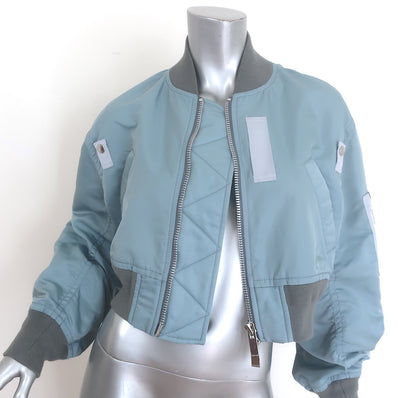 Sacai cropped MA-1 padded bomber jacket in light blue nylon - authentic pre-owned designer piece