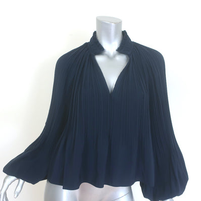 Veronica Beard Walker pleated blouse in navy with blouson sleeves — pre-owned, gently worn luxury piece