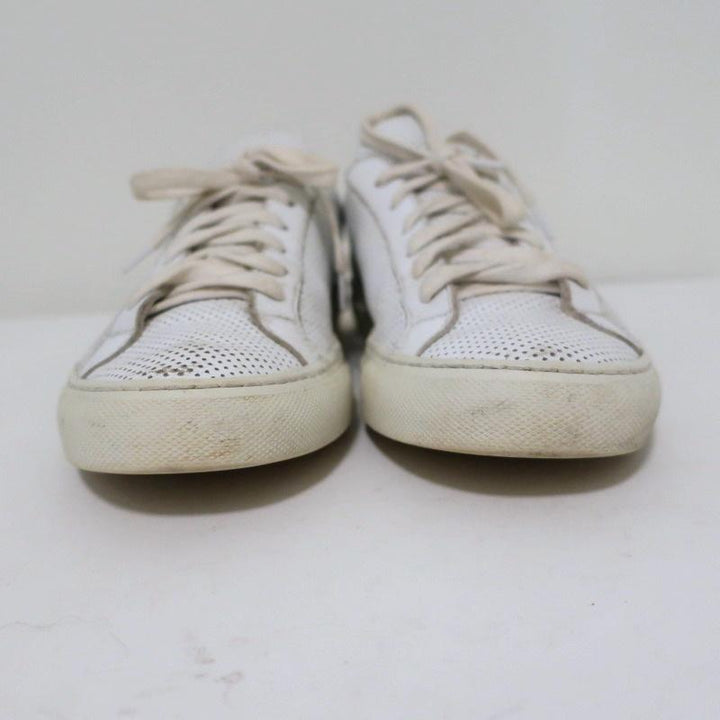 Woman by Common Projects Achilles Low Sneakers White Perforated Leather Size 38 available at CelebrityOwned.com img_5