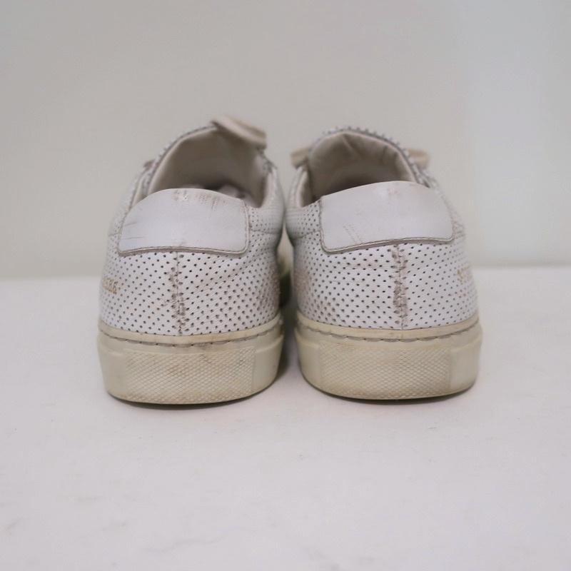 Woman by Common Projects Achilles Low Sneakers White Perforated Leather Size 38 available at CelebrityOwned.com img_8
